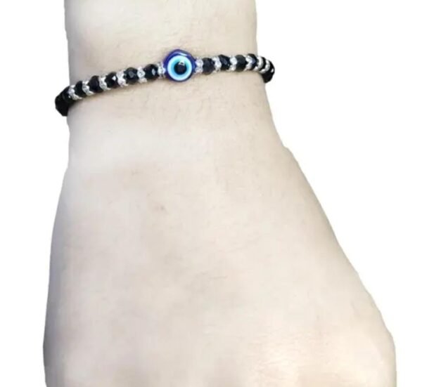 Black Evil Eye Bracelet with silver plating displayed on a hand mannequin, showcasing its adjustable fit and stylish design.