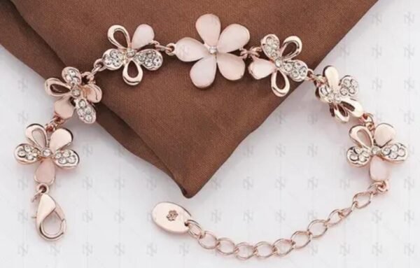 Open view of the Elegant Flower Rose Gold-Plated Crystal Bracelet, highlighting its adjustable band and intricate flower design.