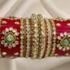 Alternate main image showcasing the Red Rajwadi Chuda, emphasizing its intricate kundan designs and vibrant red shades.