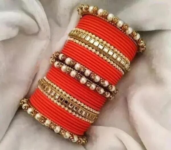 Main image showcasing the Orange Kundan Stone and Pearls Bangles Set, featuring intricate kundan and pearl work on a durable metal base, perfect for ethnic wear and special occasions.