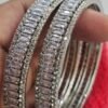 Close-up of the Silver-Plated Bangles Set, featuring cubic zirconia and American diamonds, photographed from the left angle for a detailed view.