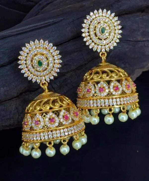 Gold-plated matte American diamond jhumki earrings with pearls in pink and green, designed for ethnic and festive wear. Crafted in brass with intricate detailing for a luxurious touch.