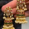 Premium gold-plated matte finish jhumka earrings featuring multicolor Kundan stones and pearls, designed for ethnic wear.