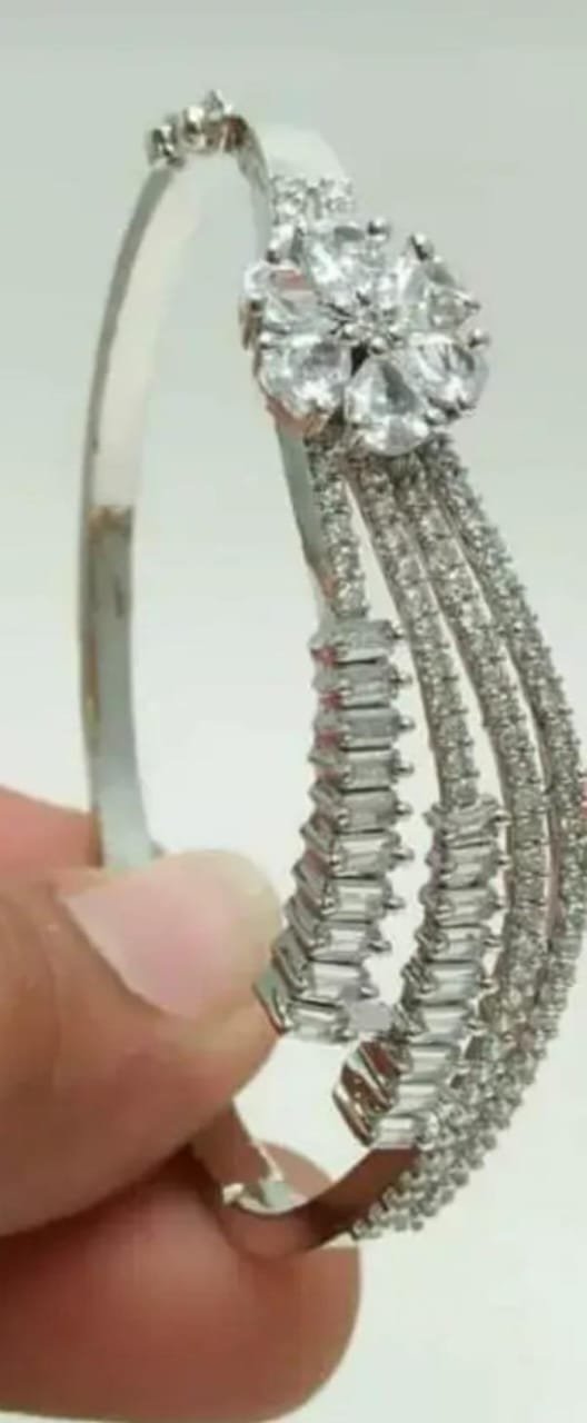 Front view of silver-plated American diamond cubic zirconia cuff bracelet, featuring intricate detailing and a refined finish.