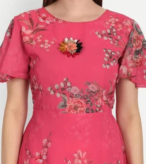 Close-up of the pink floral maxi dress top, showcasing round neck, flared sleeves, soft georgette fabric, and intricate floral patterns.