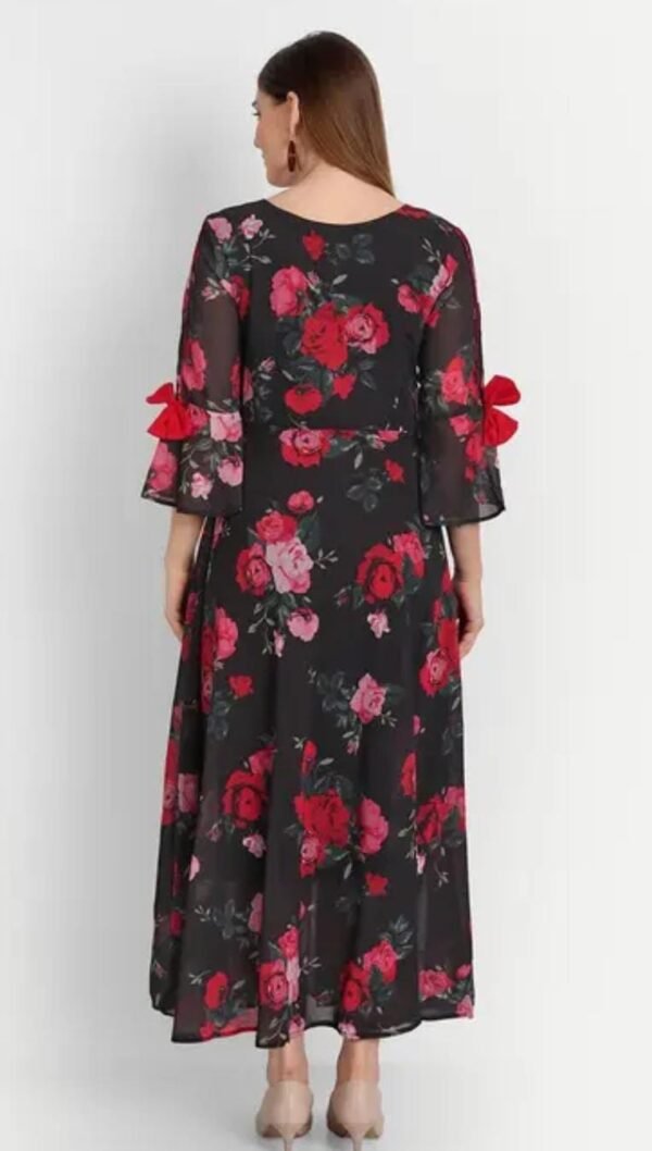Back view of black maxi dress featuring pink roses, georgette fabric, fit and flare shape, and elegant flowy bell sleeves.