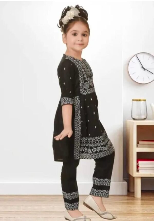 Side profile of black cotton blend kurta pant set, knee-length, printed fabric, comfortable fit.