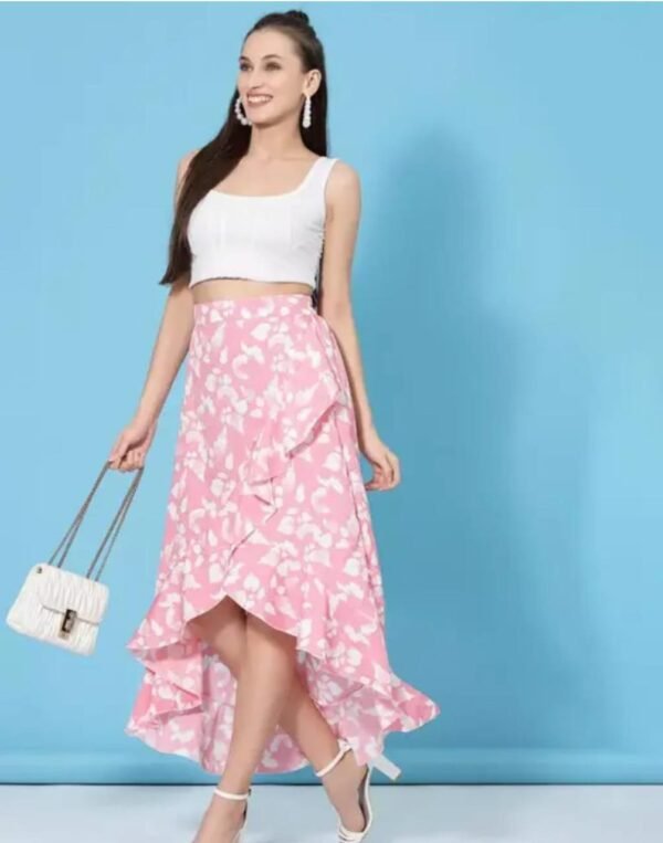 Front view of a women's floral asymmetric high-low skirt in pink, made from crepe fabric with an elastic waistband.