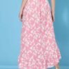 Back view of a women's floral asymmetric high-low skirt in pink, highlighting the cascading hemline and crepe fabric.
